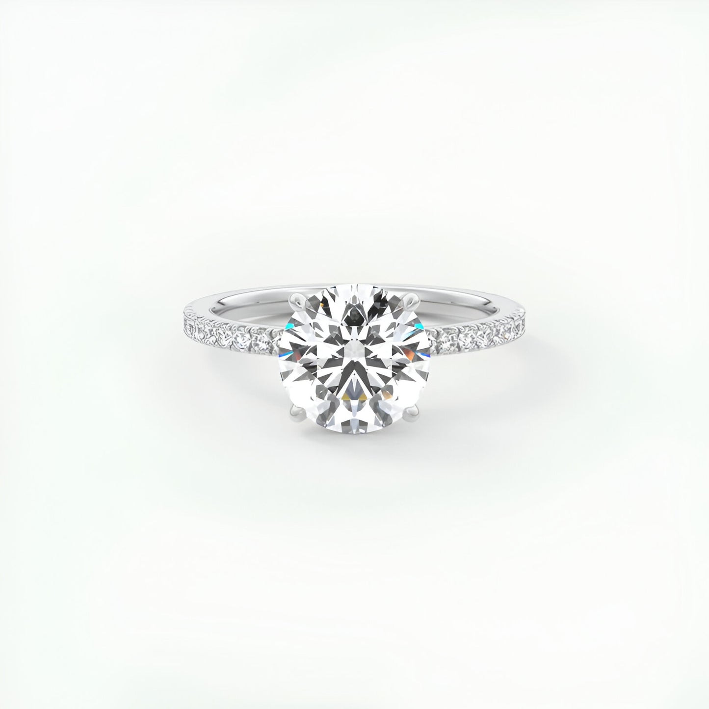 Bague solitaire rhodiée diamant rond en argent à plat vue de face sur fond blanc.