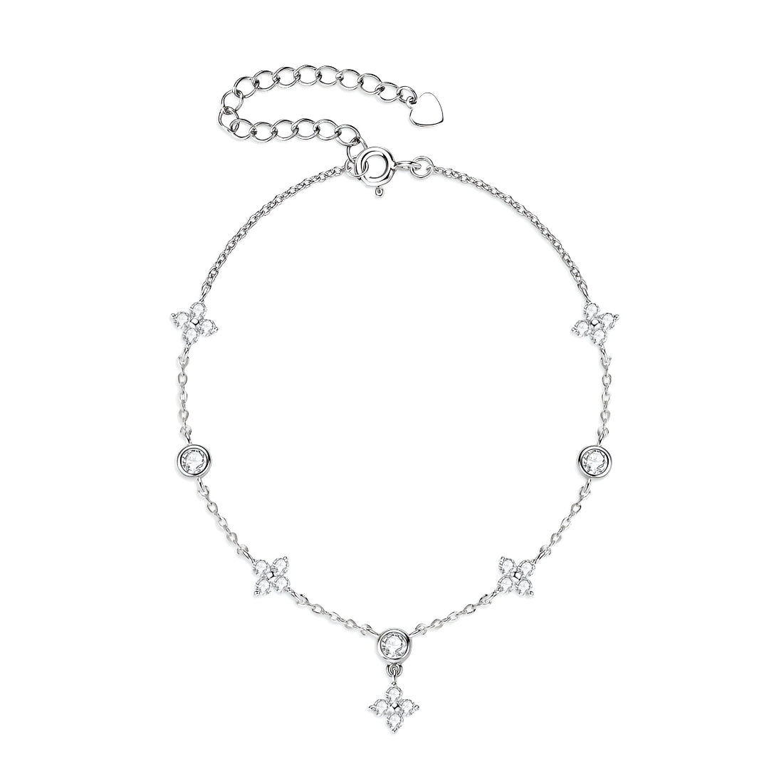 Bracelet Pluie de Lumière en Or Blanc 18K pour femme, orné de pierres de moissanite scintillantes serties dans un design élégant. Chaque pierre est entourée d'un cercle argenté orné de moissanite, créant une brillance subtile et raffinée.