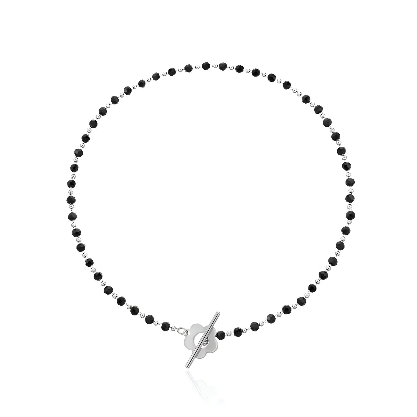 Collier ras-du-cou fleur de marguerite en plaqué or blanc et cristaux noirs sur fond blanc.
