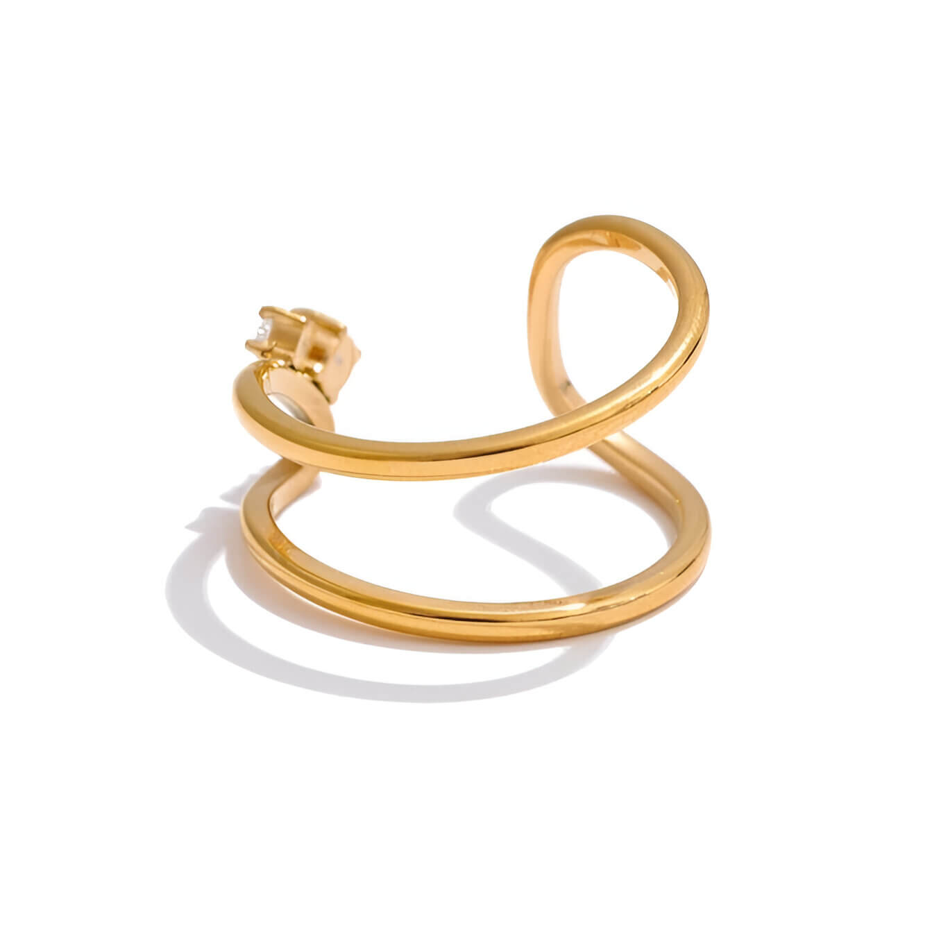 Bague fine courbée Spinela en acier 316L plaqué or jaune 18K et oxydes de zirconium sertis quatre griffes vue de dos.