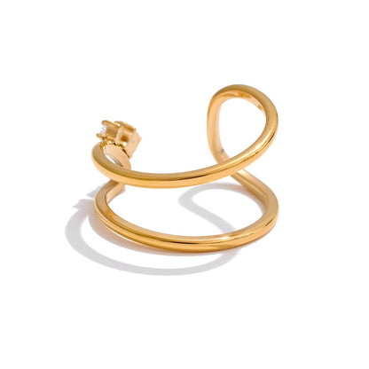 Bague fine courbée Spinela en acier 316L plaqué or jaune 18K et oxydes de zirconium sertis quatre griffes vue de dos.
