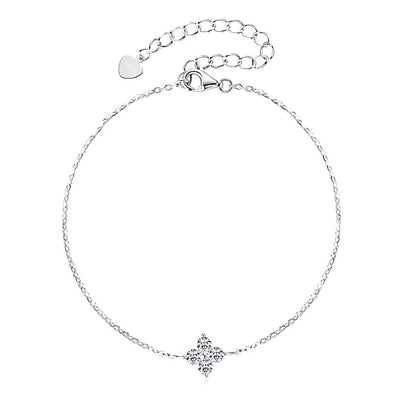 Bracelet chaîne fine fleur pavée en argent 925 plaqué or blanc et moissanites étincelantes vue du dessus.