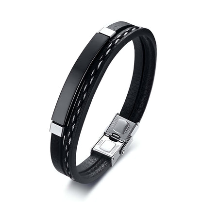 Bracelet cordon en cuir et acier inoxydable variante noir sur fond blanc.