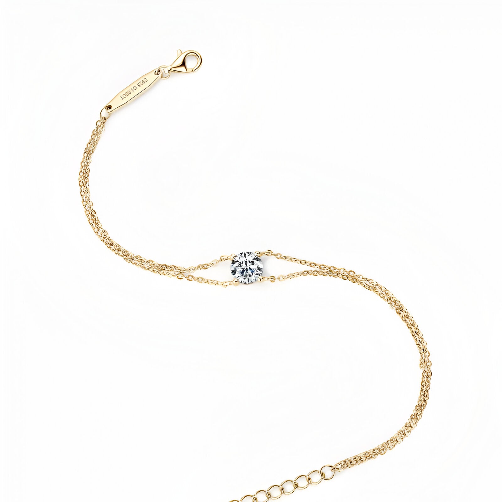 Bracelet double maile dorée en argent 925 plaqué or jaune chaleureux et diamant solitaire vue du dessus.