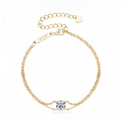 Bracelet double maile dorée en argent sterling 925 plaqué or jaune et diamant solitaire vue de face.