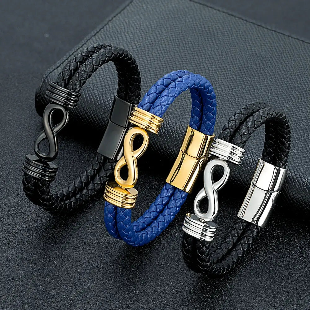 Bracelets infini en cuir noir et bleu, et acier inoxydable plaqué or jaune, argent 925 blanc et noir debout.