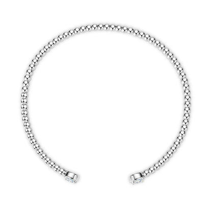 Jonc granulé Elianë en argent 925 plaqué or blanc discret et moissanites serties 4 griffes vue du dessus.