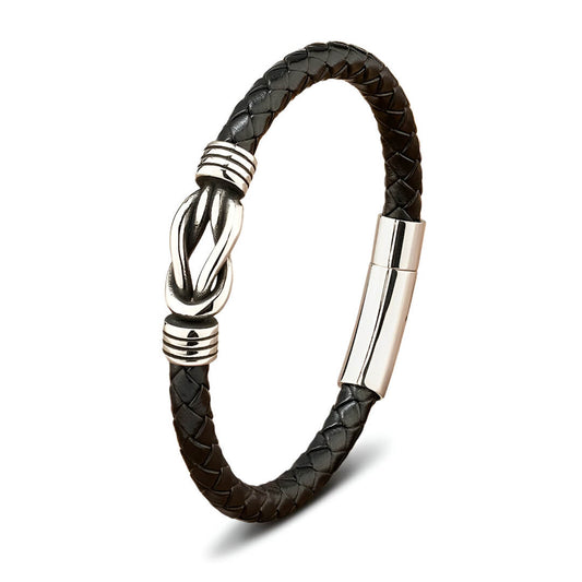 Bracelet liaison nœud argenté en cuir  noir tressé et acier inoxydable plaqué titane sur fond blanc.