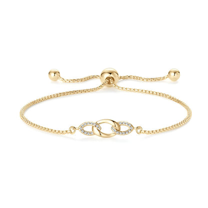 Chaîne amovible nœud en argent plaqué or jaune et diamants synthétiques sur fond blanc.