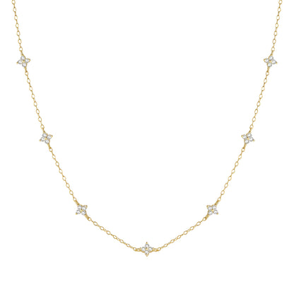 Chaîne fleurs de diamants naturels en or jaune sur fond blanc.