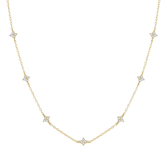 Chaîne fleurs de diamants naturels en or jaune sur fond blanc.