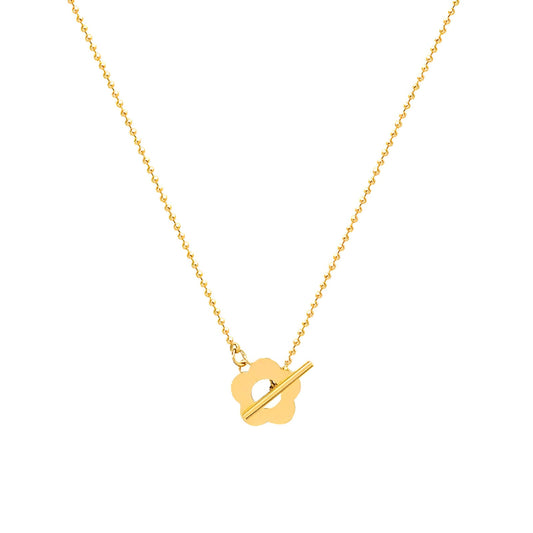 Collier choker fleur de marguerite en acier inoxydable plaqué or jaune sur fond blanc.