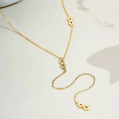 Collier long motif infini albert en argent 925 plaqué or jaune et diamants en zircon à plat.