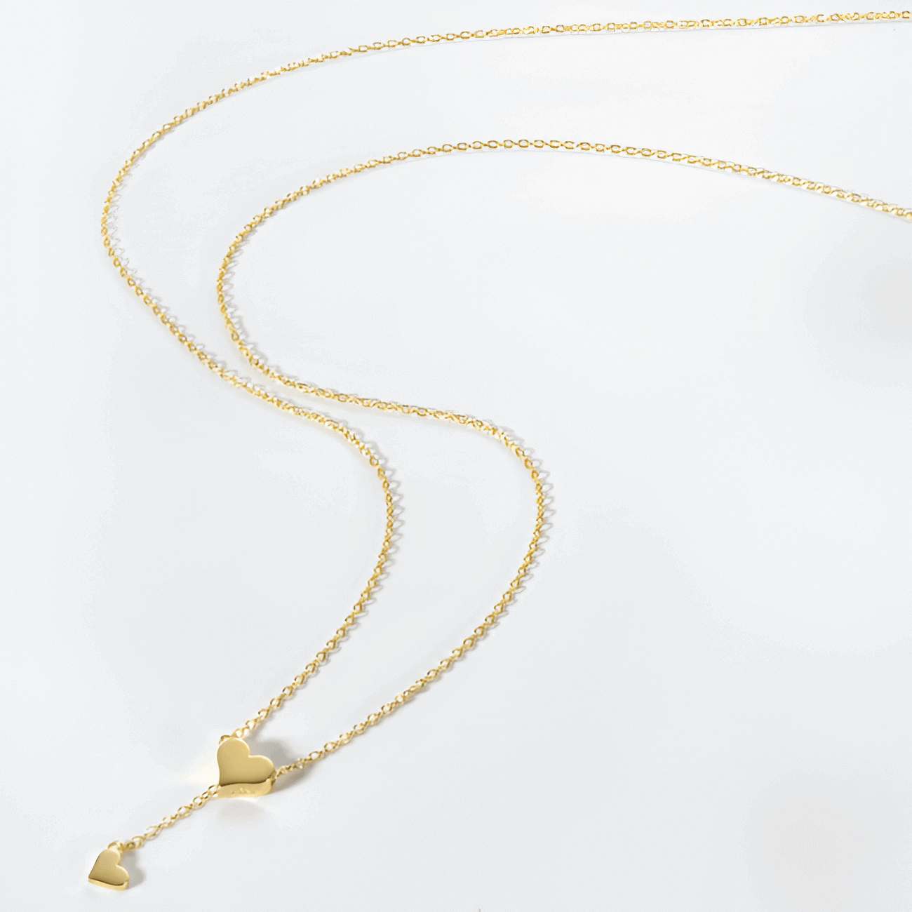 Collier sautoir cœur amovible en argent plaqué or jaune à plat.