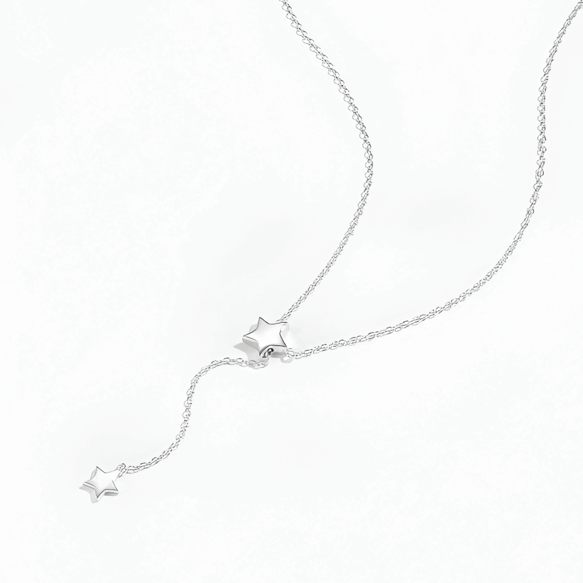 Collier sautoir étoile amovible en argent plaqué or blanc à plat.