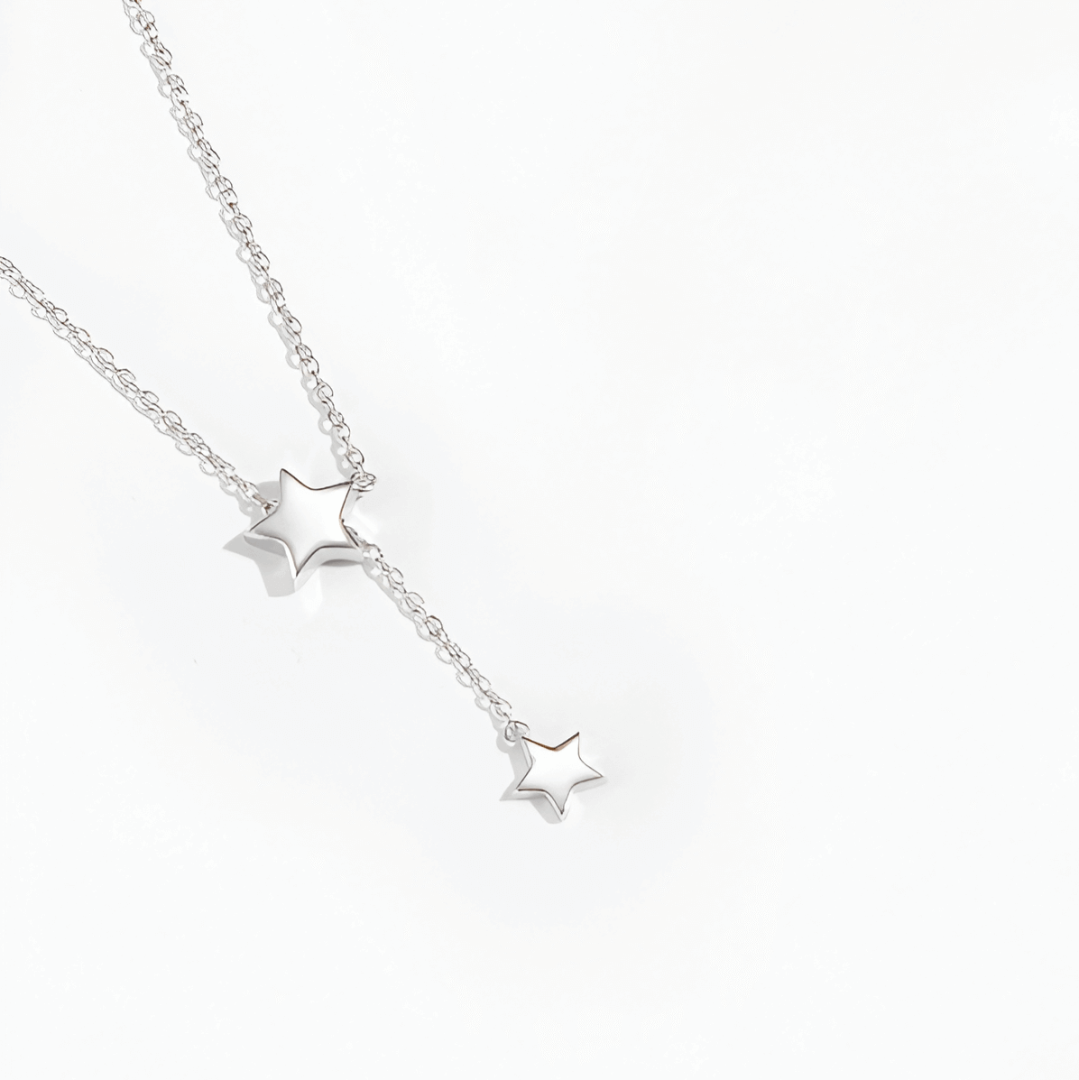 Collier sautoir étoile amovible en argent plaqué or blanc vue de proche.