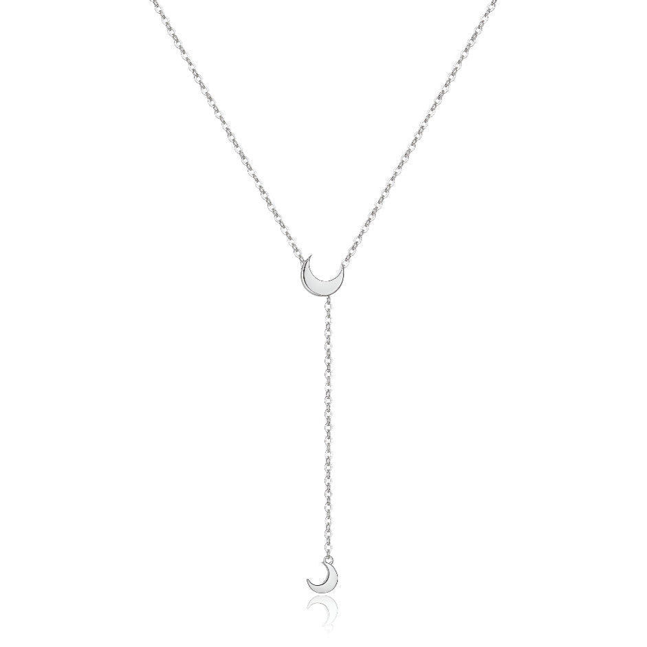 Collier sautoir lune amovible en argent 925 plaqué or blanc sur fond blanc.