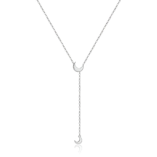 Collier sautoir lune amovible en argent 925 plaqué or blanc sur fond blanc.