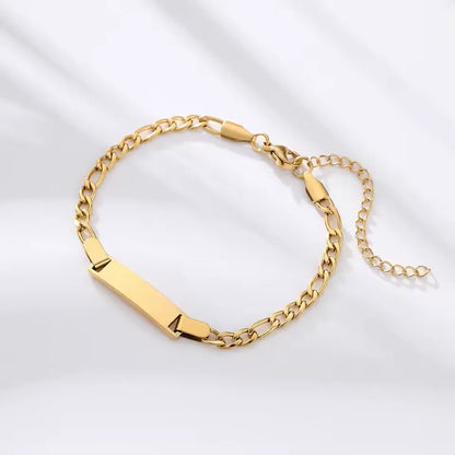 Gourmette chaîne cubaine ajustable en acier doré vue du dessus.