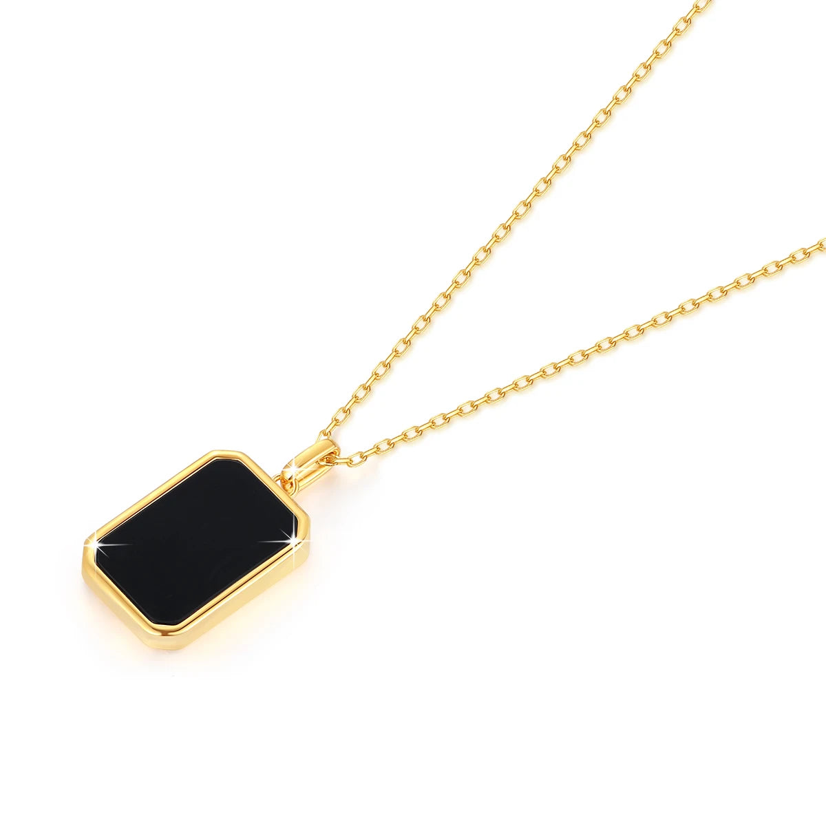 Pendentif médaillon rectangulaire en or jaune et onyx noir à plat.
