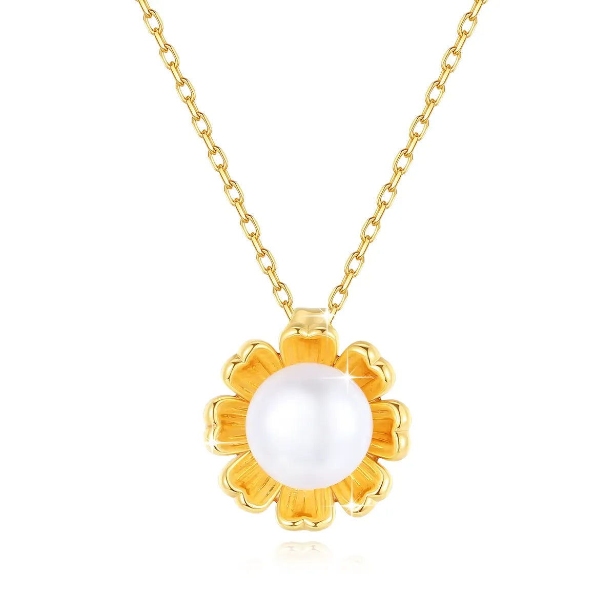 Pendentif fleur de tournesol en or jaune et perle nacrée sur fond blanc.