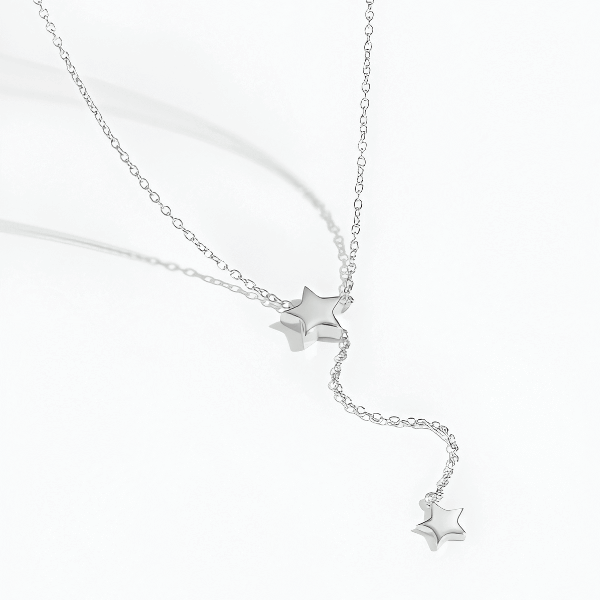 Sautoir ajustable constellation glissante en argent sterling 925 plaqué or blanc à plat.