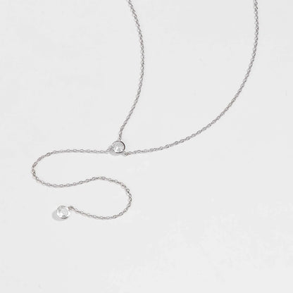 Sautoir long pendentif en argent 925 plaqué or blanc et diamants à plat.
